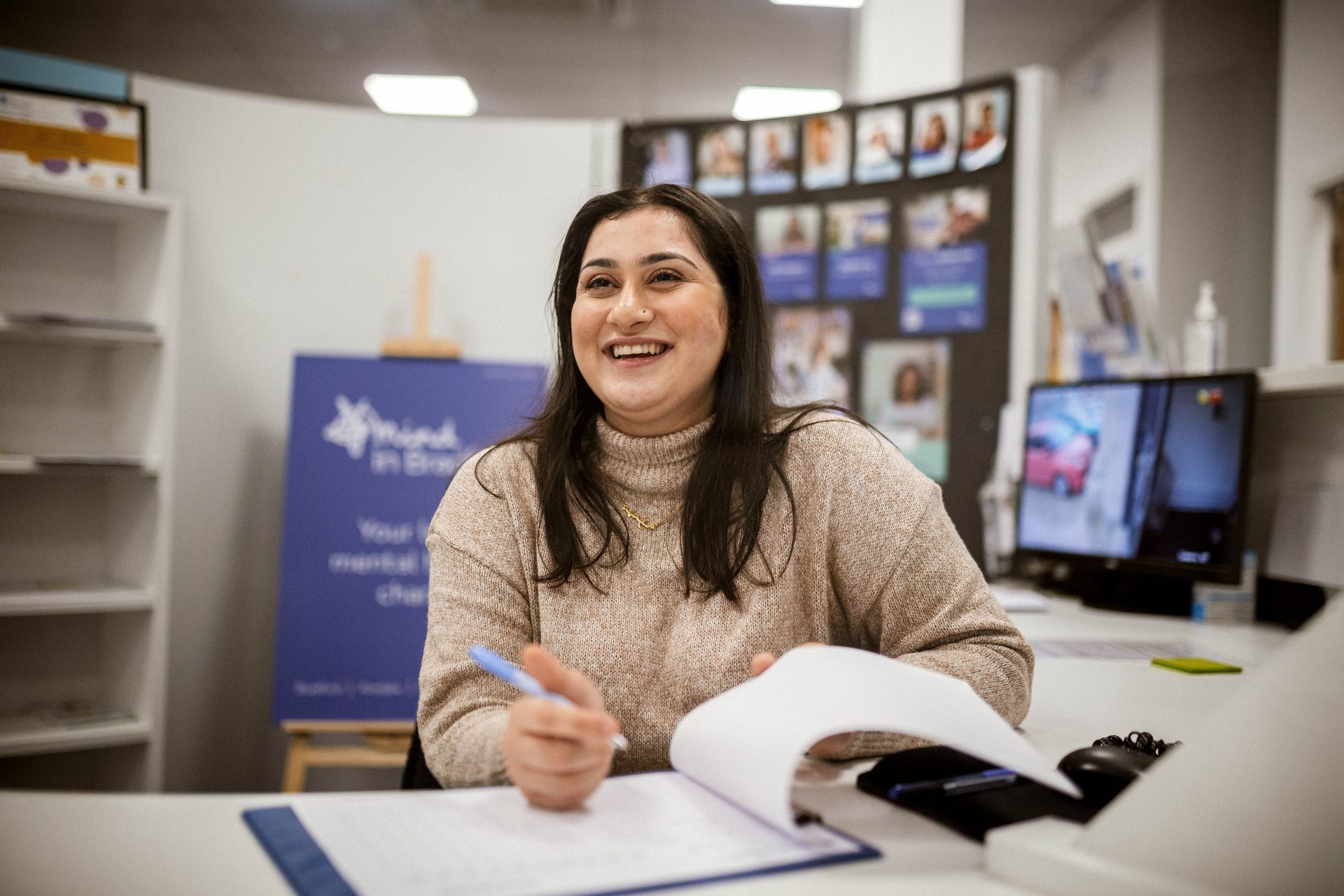 Smiling receptionist at Mind in Bradford