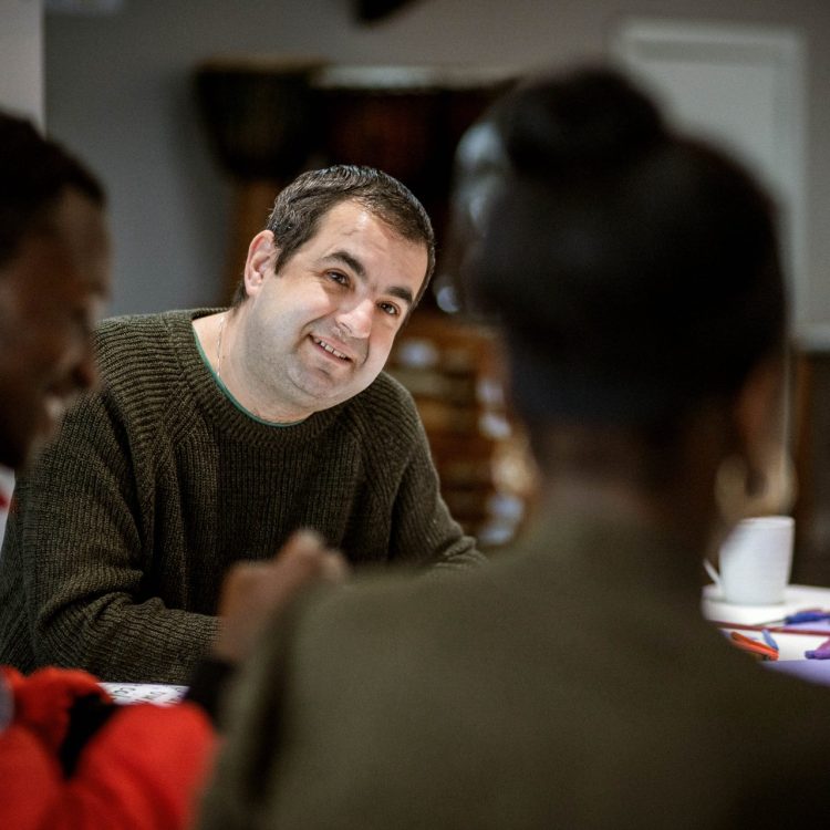 Man in wellbeing group with other people