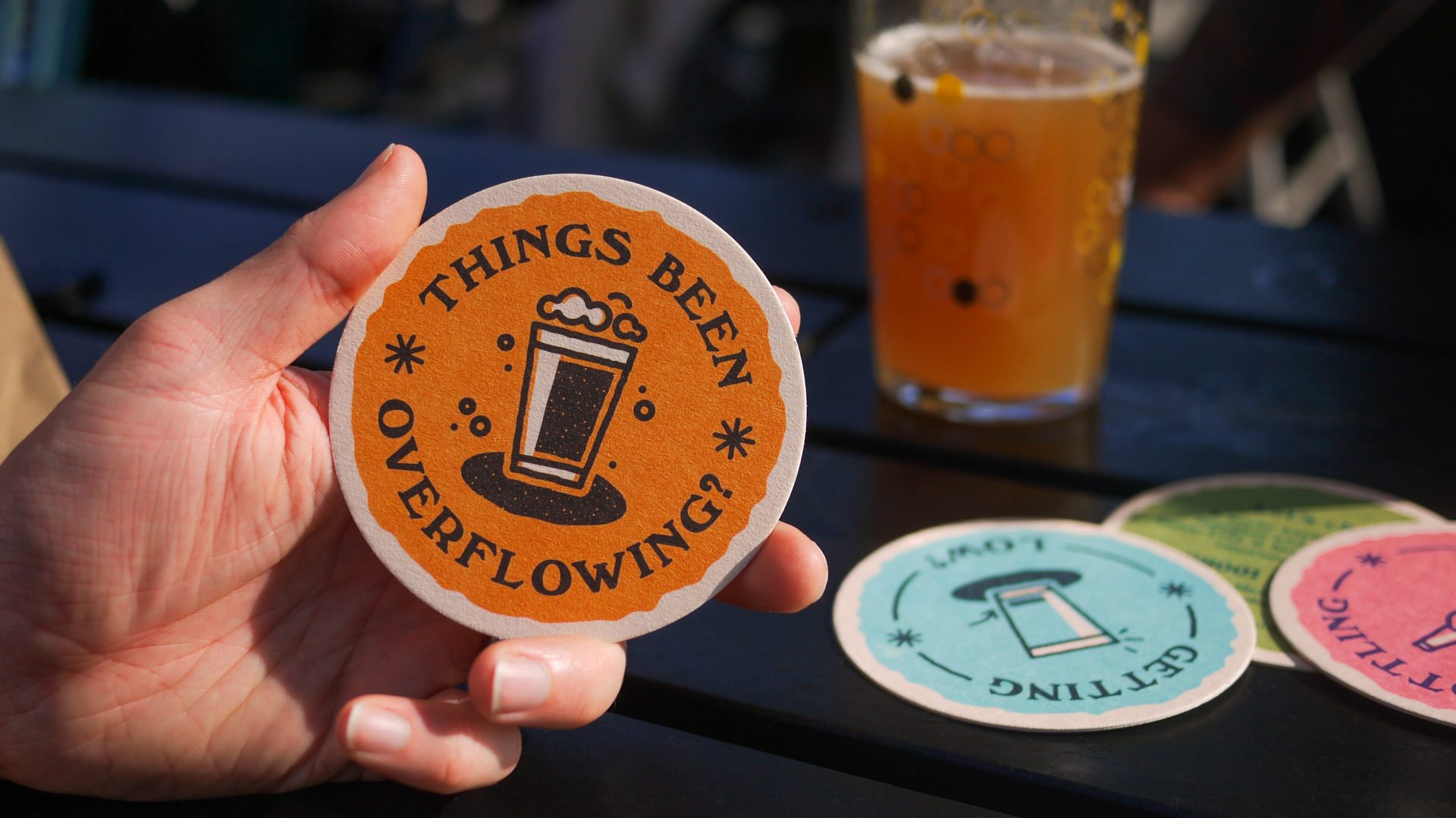 Man holding a beer mat