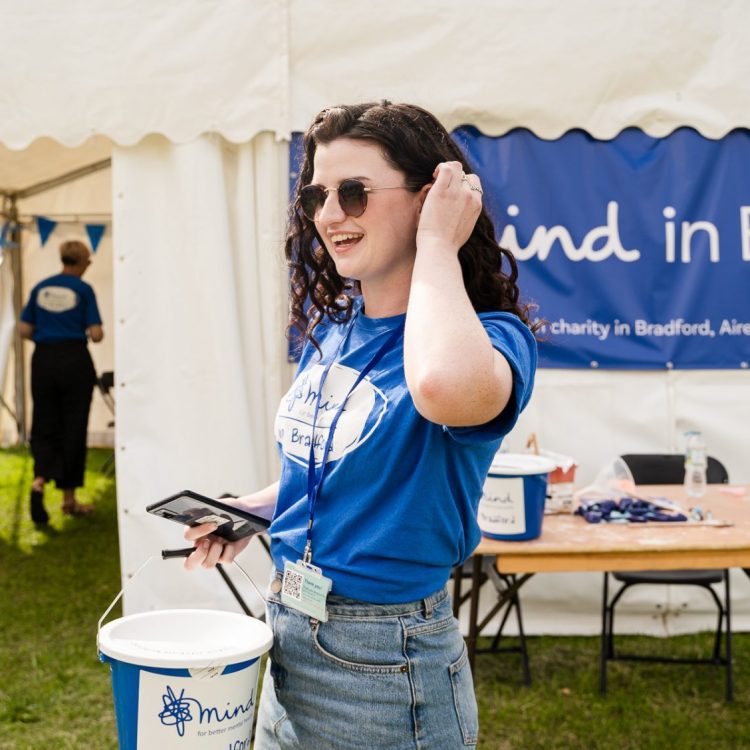 Woman holding fundraising bucket