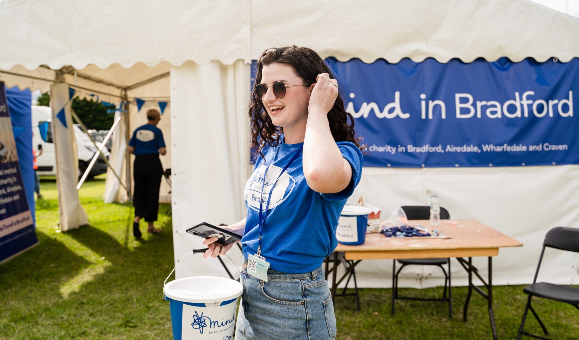 Woman holding fundraising bucket